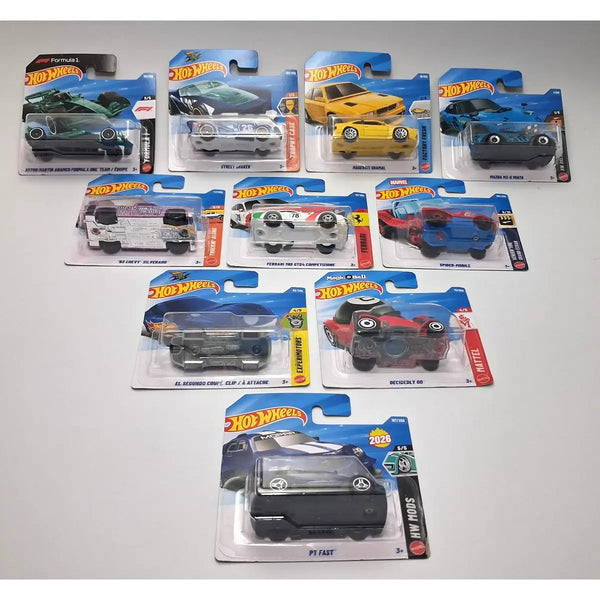 A collection of ten Hot Wheels toy cars in their original blister packaging, arranged on a light gray surface.