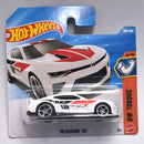 Hot Wheels '18 Camaro SS HW Torque die-cast toy car in its original blister packaging, featuring a white car with red and black graphics.
