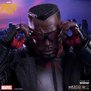 Marvel's Midnight Suns One:12 scale collectible figure of Nick Fury wearing his signature black and red tactical suit and sunglasses, posed with hands near his face against a stylized purple and blue city skyline background.