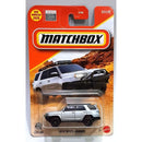 Matchbox die-cast toy car of a 2019 Toyota 4Runner in silver, packaged on its original orange and white carded blister pack.