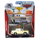Mattel Disney Pixar Cars Brad Winmillmer die-cast metal toy car in its original blister card packaging, featuring a cream-colored car with a yellow tow truck attachment.