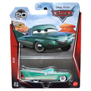 Mattel Disney Pixar Cars Flo die-cast metal toy car in its original blister card packaging, featuring a green car with white stripes and a desert-themed background illustration.