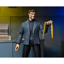 NECA Gargoyles Ultimate David Xanatos 7-Inch Scale Action Figure, figure holding necklace