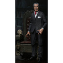NECA Vincent Price 7 Inch Scale Action Figure, in front of chair and skull