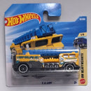 Hot Wheels Mattel 5 Alarm NW Heavy Weights die-cast toy truck in its original blister card packaging, featuring a yellow, blue, and black truck with a blue alarm system.