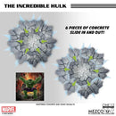 Mezco Toyz The Incredible Hulk toy set with shattered concrete pieces and Marvel logo.