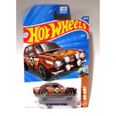 Hot Wheels 2010 Ford Escort RS1600 die-cast toy car in its original blister card packaging, featuring a brown race car with number 70 on a blue and orange card.