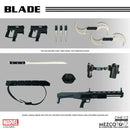 A product display sheet for a Marvel Blade collectible toy set, showing multiple included pieces such as two sub machine guns, three staves, two throwing knives, two katanas, a knife, a customized machine gun, holsters, and a belt, arranged on a light gray background with text labels and Marvel/Mezco Toyz branding.