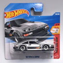 Hot Wheels '82 Toyota Supra die-cast toy car in its original blue and red blister card packaging, featuring a silver car with black and red stripes.