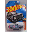 Hot Wheels '83 Chevy Silverado toy car in packaging with blue and red design
