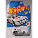 A Hot Wheels 1988 Mitsubishi Starion die-cast toy car in its original blister card packaging, featuring a white car with red and black racing decals.