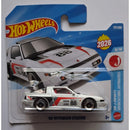 Hot Wheels die-cast toy car of the '88 Mitsubishi Starion. The packaging features a blue and white design with the Hot Wheels logo and a graphic of the white race car with red and black decals.