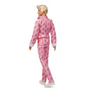 Barbie Ken doll wearing pink pajamas with red patterns on a white background