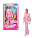 Barbie the movie Ken doll in pink pajama set with packaging on a white background