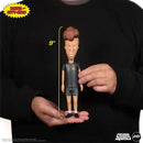 Butt-head Figure held in hands with measurement label, wearing a black outfit with 'SQUADS' text.