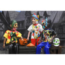Three animated characters in colorful outfits with a Halloween-themed background