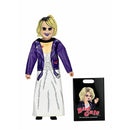 Action figure with purple jacket and white dress, featuring a 'Bad gals' packaging.
