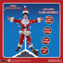 Action figure of Clark Griswold from National Lampoon's Christmas Vacation with light-up features on a blue and red background.