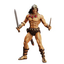 Action figure of a muscular character with armor and weapons on a white background