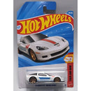 Hot Wheels die-cast toy car of a 'C1 Corvette Grand Sport in white with blue and red racing stripes, packaged on its original blue card with the Hot Wheels logo.