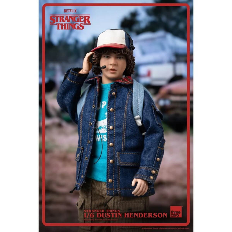 ThreeZero Dustin Henderson Stranger Things Action Figure, 1/6 Scale, closeup using headphone