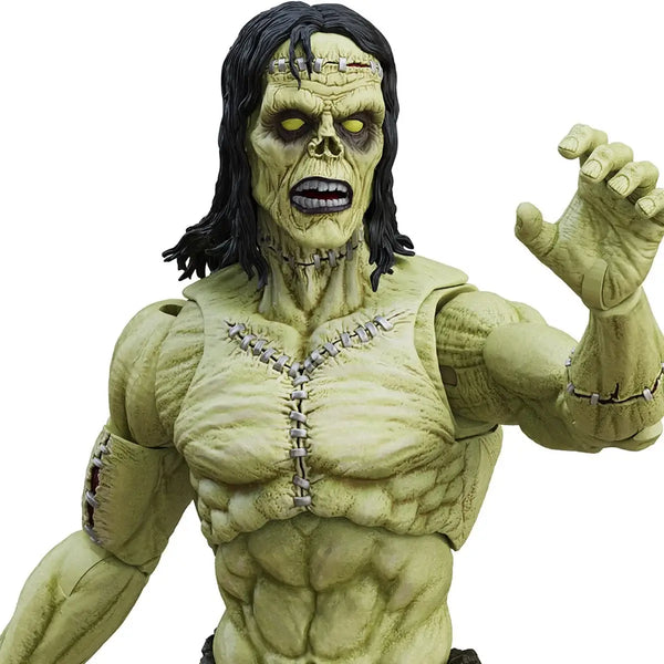 Green action figure with black hair and muscular build on a white background