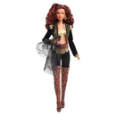 Fashion doll with leopard print outfit on a white background