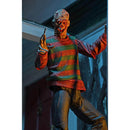 Freddy Action figure in a striped sweater with a dark background