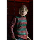 Freddy Figure wearing a red and green striped sweater wearing kids mask against a dark background