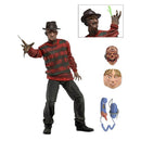 Freddy from nightmare on elm st action figure in a red sweater with accessories on a white background