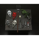 Set of toy weapons and masks on a dark surface