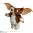 Gremlins 2: The New Batch Gizmo Mogwai Prop Replica, standing to the side with right arm/hand up and left arm/hand down