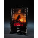  Godzilla movie poster on a stand with dark background
