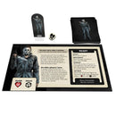 Board game components including cards and a mat with character illustrations and game text.