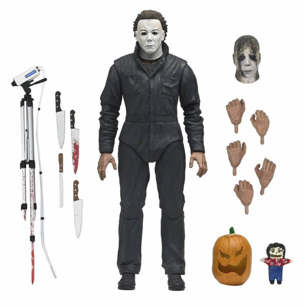 Halloween Resurrection Ultimate Michael Myers 7-Inch Scale Action Figure pictured with added accessories which include spare head, hands, weapons, and pumpkin with scary face