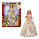 Barbie doll in a gold gown with packaging labeled 'Holiday Barbie 2023'.