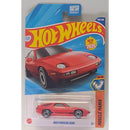Hot Wheels 1983 Porsche 928S toy car in packaging with blue and red design.