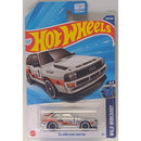 Hot Wheels '84 Audi Sport Quattro toy car in packaging with blue and red design