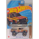 Hot Wheels toy car packaging with a red and yellow truck on a blue background