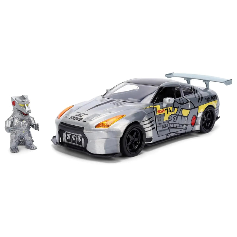 collectible car with mechagodzilla figure on a white background