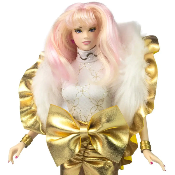 Jem Glitter and Gold Doll with pink and white hair, gold outfit, and large gold bow on a white background