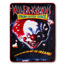 Blanket with a clown design and text from 'Killer Klowns from Outer Space' on a black background.