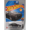 Hot Wheels Maserati Shamal toy car in packaging on a gray background