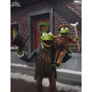 The Muppet Christmas Carol collectible figure showing Kermit the Frog dressed as Ebenezer Scrooge, carrying a smaller Kermit figure dressed as Christmas Carol.