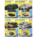 Four Matchbox die-cast toy cars in their original blister packaging, arranged in a 2x2 grid. The packages feature yellow and blue designs with car illustrations and the text 'MATCHBOX LIFETIME'.