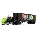 A toy semi-truck with a black trailer carrying colorful 'Happy Toyz' lettering, shown on a plain white background.