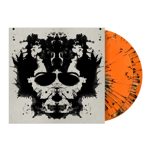 Vinyl record with orange and black design and matching cover featuring a black and white abstract face.