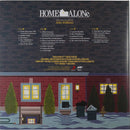 Album cover for 'Home Alone' by John Williams with a snowy scene and house illustration.