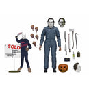 Halloween The Curse of Michael Myers Ultimate NECA Action Figure pictured with accessories which include weapons, pumpkin, two additional masks, and Strode Realty sign with Michael Myers cutout
