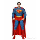 Superman action figure in blue and red costume with cape on a white background